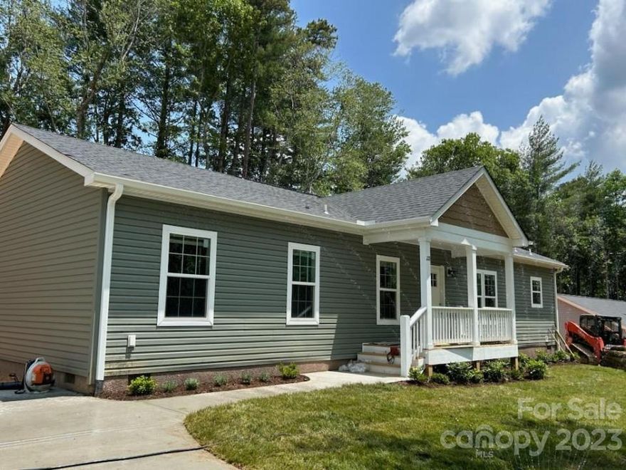 Just hitting the market, property for sale at 1755 St Pauls Rd, Hendersonville, NC. New construction split bedroom floor plan with 9' ceilings, crown molding, Stainless Steel Appliances, pantry, tile primary bath walk-in shower, double vanities in both bath rooms, mud room entrance, concrete driveway, front covered porch and rear wood deck. Located near the end of a quiet paved cul-de-sac private road.