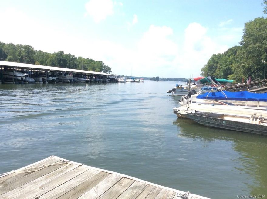 Affordable Lake Wylie living in charming Tega Cay. This town home features a shared dock and a seasonal water view of the lake. Two level deck, hot tub on lower and screened in porch above for cool summer nights.  A new renovated master bathroom and 2 master size bedrooms. Don't forget to take a stroll to the dock.