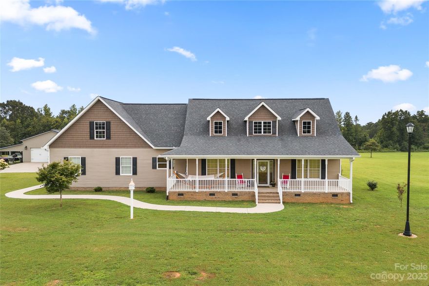 This stunning custom built craftsman style home on 13.35 acres is a must see. Already in place is a 32x42 metal building with 2 garage doors, a workshop and 2 14x42 sheds on either side. Built in 2015, the one and a half story home has a rustic log cabin interior with a two story living room, a sunroom and a desirable open concept design. You’ll find gorgeous hickory hardwood floors and handsome knotty pine boards on the walls and ceilings. The primary bedroom is located on the main floor. Upstairs you will find a 12x23 loft, a second bedroom/bath and a 674 sqft unfinished bonus room. Septic for 3 bed. The home is also equipped with windows which are vinyl exterior and wood interior, a 10x12 pantry/storage room, a whole house generator, 2 heat pumps that are only 3 months old and 2 propane tanks. If you love history or taking long walks through the woods, you will love that this home is walking distrance to the Cowpens National Battlefield Park which offers nearly 800 acres to explore!