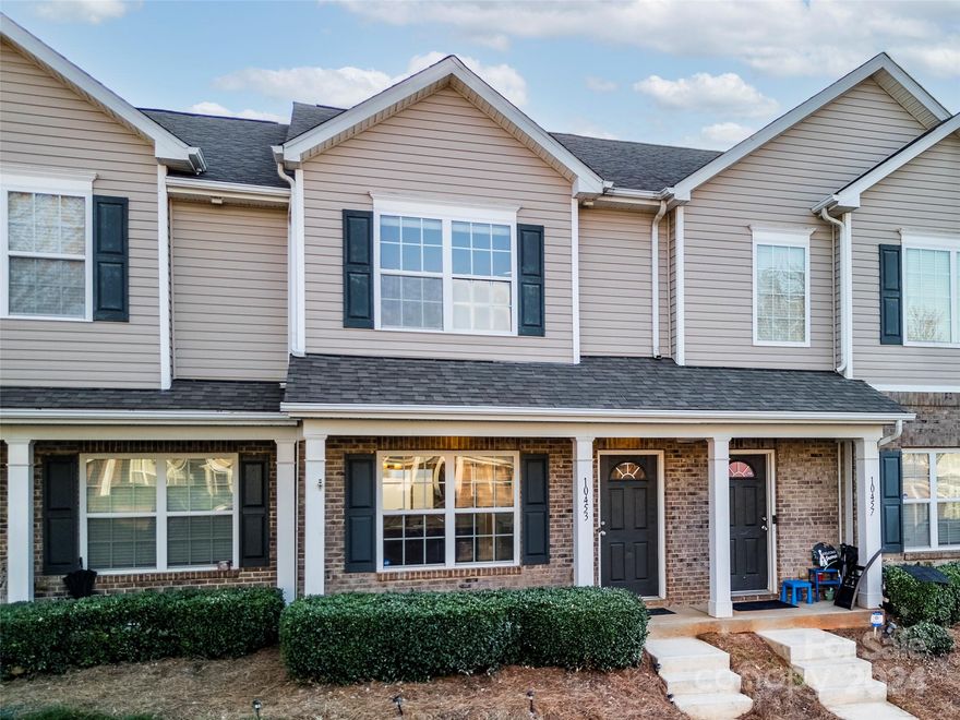 Welcome home to Carolina Crossing! This townhome boasts a welcoming ambiance with its layout and modern comforts. Discover an open dining area and spacious living room with a cozy fireplace on the first floor. A well-appointed kitchen, convenient half bathroom, and updated flooring complete this level. Journey upstairs to find solace in the primary bedroom, featuring a vaulted ceiling and an ensuite. An additional bedroom and full bathroom offer ample space for guests or family. No more hauling laundry up and down stairs with the upstairs laundry area. Step outside to your fenced backyard, perfect for outdoor gatherings and relaxing evenings. Plus, take advantage of the community pool just a stone's throw away or explore the nearby nature trail leading to Lake Park and the Canine Commons Dog Park for some outdoor adventures. With its proximity to downtown Pineville, Ballantyne, and easy access to I-485, shopping, and dining options, this home offers comfort and convenience.