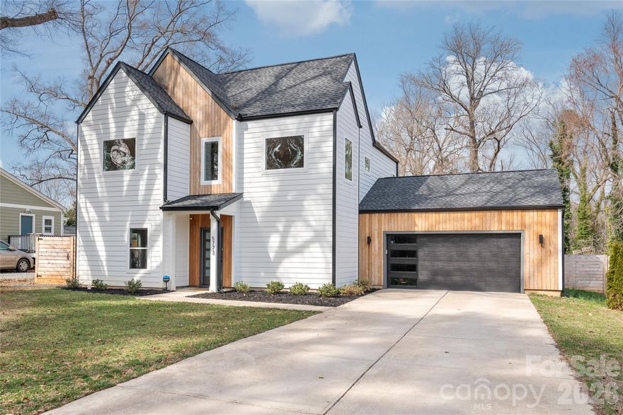 Built in 2022, this beautiful CUSTOM-BUILT modern home is just 15 minutes to DOWNTOWN CHARLOTTE and 10 minutes to NODA & PLAZA MIDWOOD! Offering 4 bedrooms and 3 full baths, the home features an open floor plan with HARDWOOD FLOORING THROUGHOUT and a desirable main-level bedroom with full bath — perfect for guests or a private home office.
The GOURMET KITCHEN showcases an impressive 8-FOOT white QUARTZ ISLAND, quartz countertops, ample cabinetry, and a VENT HOOD with exhaust fan VENTED TO THE EXTERIOR  — a true chef’s upgrade. The living area flows seamlessly to an extended outdoor patio overlooking a HUGE FENCED BACKYARD, ideal for entertaining and outdoor living.
Additional highlights include a TWO-CAR GARAGE with EV CHARGER already installed, MODERN FINISHES throughout, close proximity to shopping and dining — and NO HOA for added flexibility and freedom.
Don’t miss out on this rare find! Schedule your showing today!
