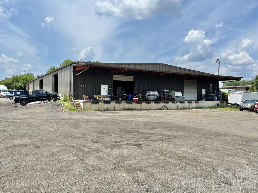 Heavy Industrial (ML-2) property in northeast Charlotte. ±16,000 SF metal building. 1.74 acres. 18 FT peak, 15 FT edge clear height. Two dock doors, Three 14 FT x 14 FT grade-level drive-in doors. Metal roofing. Two bathrooms. Outdoor storage and parking capable of accommodating +20 tractors and trailers with unobstructed access. Large, fenced outdoor storage area. Perfect for Owner-User. Below market-rent tenant in place with lease through December 31, 2026. 2.0 miles to I-85, 2.0 miles to I-77, 3.0 miles to Uptown.