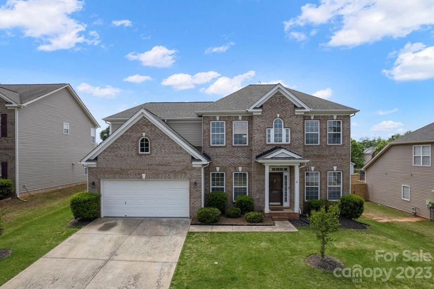 Great Indian Trail location.  Open floorplan with a room to the left which could be an office or play area.  Primary bedroom on the main floor.  Two story Greenroom with fireplace. Updated kitchen, black cabinets, granite countertops, and tile backsplash.  Secondary bedrooms with bonus room on the 2nd floor.  Fenced yard.