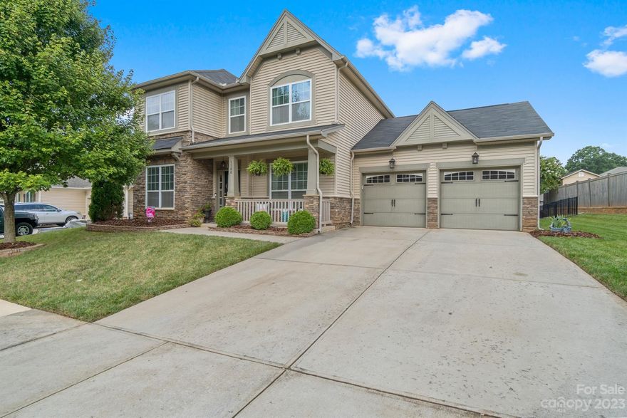 Beautiful home with a great layout in a desirable Belmont neighborhood.  You'll love the covered front porch with a view of the tree lined streets. Large covered rear porch, a paver patio, black metal fencing and gorgeous landscaping that provides a lot of privacy. Off the large foyer, you will find an office with glass french doors as well as a formal living and formal dining room.  The spacious kitchen has an eat-in breakfast area adjoining a huge family room with a beautiful stone gas fireplace.  4 Large bedrooms with spacious closets and great storage. The oversized garage has a huge storage room and utility entrance into the rear yard.