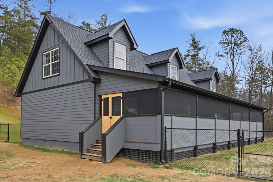 Perfectly positioned to capture the beauty of the Blue Ridge Mountains, 67 Nimitz Drive combines peaceful seclusion with everyday convenience—located just minutes from Pisgah National Forest and the vibrant shops, dining, and culture of Brevard’s downtown. Set on approximately ±2.42 unrestricted acres, this property invites you to enjoy true mountain living without limitations. Wake up to long-range mountain views and end each day with truly exceptional sunsets that paint the sky in unforgettable color. The expansive, fully fenced yard provides both security and flexibility—perfect for pets, gardening, or simply enjoying the outdoors. The home’s exterior has been extensively updated, showcasing thoughtful improvements that enhance both style and durability. One of the standout features is the full-length screened-in porch—an ideal space for relaxing, entertaining, or soaking in the peaceful surroundings year-round without the nuisance of insects. Inside, you will find new flooring, paint, and finishes that make the home feel brand new. With warm, neutral gray tones, this home has the perfect blend of soft color and materials that you desire. Whether you’re looking for a full-time residence, a mountain retreat, or an investment opportunity, this property delivers the space, freedom, and views that are increasingly hard to find—all while being conveniently close to world-class hiking, biking, waterfalls, and everything downtown Brevard has to offer.