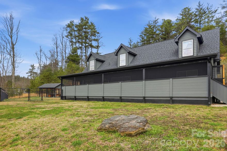 Perfectly positioned to capture the beauty of the Blue Ridge Mountains, 67 Nimitz Drive combines peaceful seclusion with everyday convenience—located just minutes from Pisgah National Forest and the vibrant shops, dining, and culture of Brevard’s downtown. Set on approximately ±2.42 unrestricted acres, this property invites you to enjoy true mountain living without limitations. Wake up to long-range mountain views and end each day with truly exceptional sunsets that paint the sky in unforgettable color. The expansive, fully fenced yard provides both security and flexibility—perfect for pets, gardening, or simply enjoying the outdoors. The home’s exterior has been extensively updated, showcasing thoughtful improvements that enhance both style and durability. One of the standout features is the full-length screened-in porch—an ideal space for relaxing, entertaining, or soaking in the peaceful surroundings year-round without the nuisance of insects. Inside, you will find new flooring, paint, and finishes that make the home feel brand new. With warm, neutral gray tones, this home has the perfect blend of soft color and materials that you desire. Whether you’re looking for a full-time residence, a mountain retreat, or an investment opportunity, this property delivers the space, freedom, and views that are increasingly hard to find—all while being conveniently close to world-class hiking, biking, waterfalls, and everything downtown Brevard has to offer.