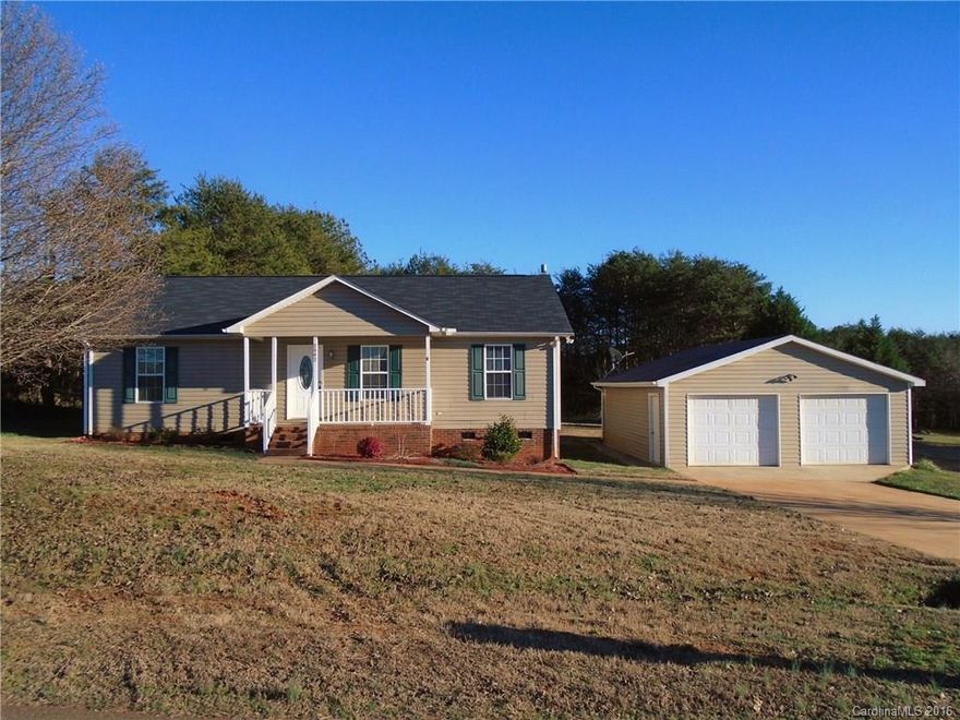 Visit this country ranch on a flat 0.92 acre lot. Quiet location; Oversized, true 2 car garage; Roof - 2014; Covered front porch; Rear deck and side and rear treelines; Kitchen is open to the LR; Large laundry room, newer front load washer/dryer; Brushed nickel fixtures; Ceiling light fans; Newer stainless steel refrigerator, dishwasher, microwave and stove; Ceramic tiled kitchen and laundry floor; This home is close to Hwys 150, 40, 16 and 10 AND is minutes from the Lake Norman public boat ramp