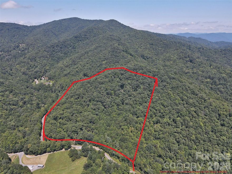 Beautiful 20+ acre mountain property located along paved Cove Creek Road in Waynesville, NC. The land offers excellent road frontage and a gravel driveway leading to a cleared homesite, making it easy to access and explore. Multiple potential build sites are located throughout the property, allowing flexibility to build near the existing homesite or higher on the land for additional privacy and possible mountain views. Mature hardwood forest and rolling mountain terrain provide the peaceful setting buyers seek in Western North Carolina. Conveniently located near Waynesville, Maggie Valley, the Blue Ridge Parkway, and Great Smoky Mountains, offering easy access to hiking, outdoor recreation, dining, and shopping. The property is currently enrolled in the Forest Management Program for reduced property taxes but can be removed if desired. Ideal for a private mountain home, cabin retreat, vacation property, or land investment in the Smoky Mountains. Soil test passed and electric at road.