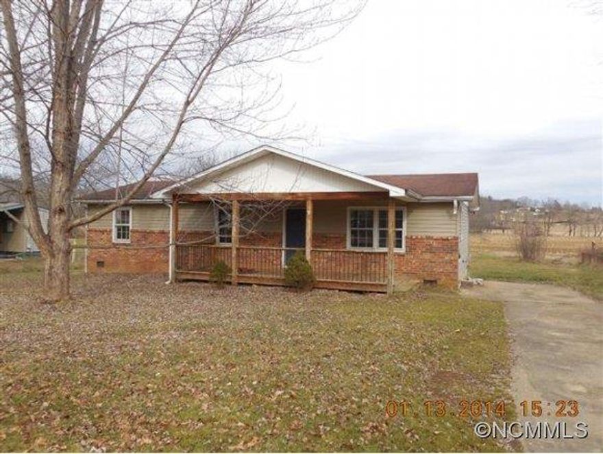 SHORT SALE! Affordable home on a flat lot with pastoral views. Large covered front deck. This home needs work, home inspection available. Wilde Law Firm will be retained by buyer and seller to negotiate the sale. Subject to third party approval. Wilde Law firm provides a free buyer consultation. See flood map.