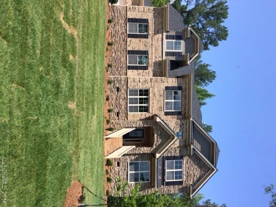 Lexington w/3 car garage, 5 br, 4.5 baths, full bed/bath on main. Both formals,Bonus up. Over 1/2 acre wooded setting, sod/irrigation. 42" painted Cabinets,built-in ovens, granite kitchen/baths, hardwoods thru-out,ceramic tile,arches,columns,heavy moldings thru-out, coffered ceiling. Owners suite features sitting area,dual closets. eBuilt with HERS,tankless & more.Beautiful stone outdoor living area and fire pit.  Great Lake Wylie location less than 5 minutes to Buster Boyd bridge!