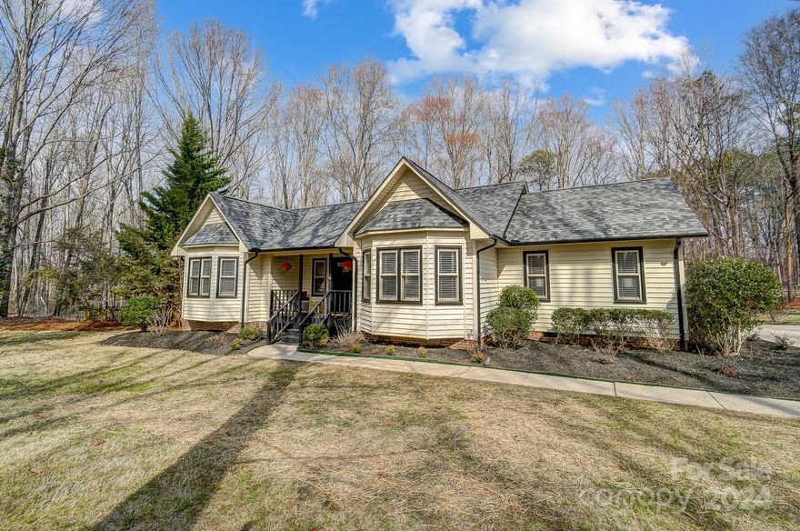 Beautifully updated home on 1.3 acres! Best of both worlds with a large corner lot with lots of privacy but less than 2 miles to Locust Town Center! Large primary suite with walk-in closet and gorgeous tiled shower. Open, airy floorplan with vaulted ceiling family room overlooking oversized new deck, great for entertaining. Move in ready with all new appliances including french door refrigerator, range, dishwasher and microwave. This one is a must see!