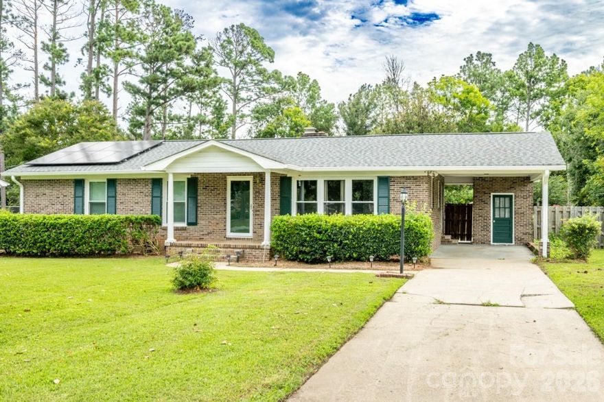 This beautifully maintained 3-bedroom, 2-bath brick ranch seamlessly blends timeless charm with modern updates. Inside, a spacious living room with a cozy fireplace creates the perfect setting for relaxing evenings or entertaining guests. The kitchen is thoughtfully designed with granite countertops, a central island, and abundant cabinetry to meet all your storage and prep needs.

Recent upgrades provide both comfort and peace of mind, including a new roof and gutters (2024), tankless water heater, energy-efficient windows, and new doors. A fully equipped solar panel system enhances sustainability while significantly reducing energy costs.

Outdoors, enjoy a private, fenced backyard complete with a storage shed—ideal for outdoor living, hobbies, or additional storage. With major improvements already completed and a focus on energy efficiency, this move-in-ready home offers exceptional value.