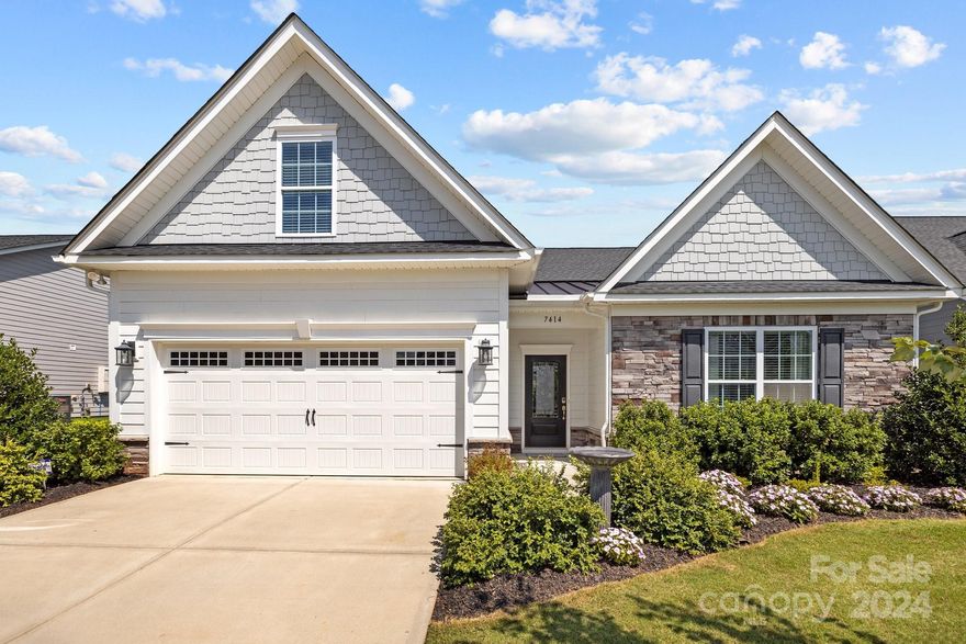 Don't wait for new construction! This immaculate, like-new home in the highly sought after 55+ neighborhood, The Villas at Covington, is just minutes from Ballantyne area amenities and has low SC taxes. Community features include a pool, clubhouse w/kitchen and craft room, fire pit, sidewalks, lawn maintenance, and more. This stunning home has a desirable open floorplan and huge kitchen island making it perfect for entertaining. You'll be drawn to the tall ceilings, light-filled sunroom, gourmet kitchen with 42" painted cabinetry and tile backsplash, granite countertops, and beautiful hardwood floors. The large dining room can also be a home office, den or flex space. The sizeable primary bedroom boasts a tray ceiling, en suite bath, and walk-in closet. A secondary bedroom, also on the main floor, has a full bath and a pocket door to create an en suite for guests. Upstairs, there's a bedroom suite w/full bath plus a large bonus room w/built-ins. Oversized garage for more storage, too!