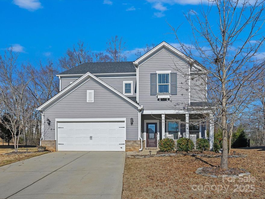This home is sure to impress!  As you enter you're greeted by tray ceilings and shiplap accent walls.  The open floor plan is highlighted by beautiful light fixtures and a gourmet kitchen with an oversized island and butler's pantry - and the walk in pantry is huge.  The living area hosts a cozy fireplace and there is a mud room hidden away as you come in from the garage.  Upstairs the loft is a great gathering space and the primary retreat is everything you could dream of, with a spa like bathroom and a vast walk-in closet that has it's own access to the laundry room. But the crown jewel is the back yard - one of the larger lots in the neighborhood, it's private and wooded and boasts a pool with a peaceful waterfall and a firepit area. Life at the end of this cul-de sac couldn't get any better, with Fort Mill Schools and about a 20 minute commute to uptown Charlotte.