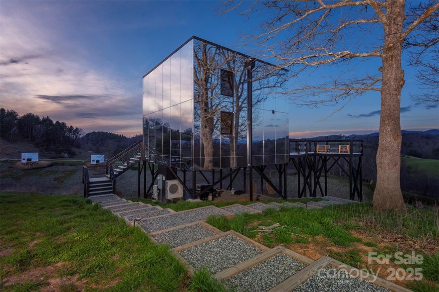 A rare opportunity to own the renowned Mirror Hotel—six architect-designed luxury short-term rental cabins on 50+ acres of rolling pasture near Asheville. Enjoy long-range mountain views, a natural pond, abundant wild berries, wildflowers, birds, deer, and new graded roads for easy access. The six mirror-clad “Invisible Cabins” blend into the landscape for a unique guest experience. Three (3) Elevated Cabins stand 16 ft above ground, each with 3 bedrooms, 1 bath, featuring modern flowing indoor-outdoor living, full kitchens, decks, hot tubs, fire pits, and pizza ovens. Three (3) Grounded Cabins, completed in 2024, feature two levels, lofted bedrooms, spa-style baths, and private hot tubs. All have smart home tech, high-speed internet, and stunning views. This income-producing property is nearly fully booked through 2025 and includes expansion rights for up to 12 more cabins. Unlock boundless potential for growth and returns in one of the region’s most inspiring settings.