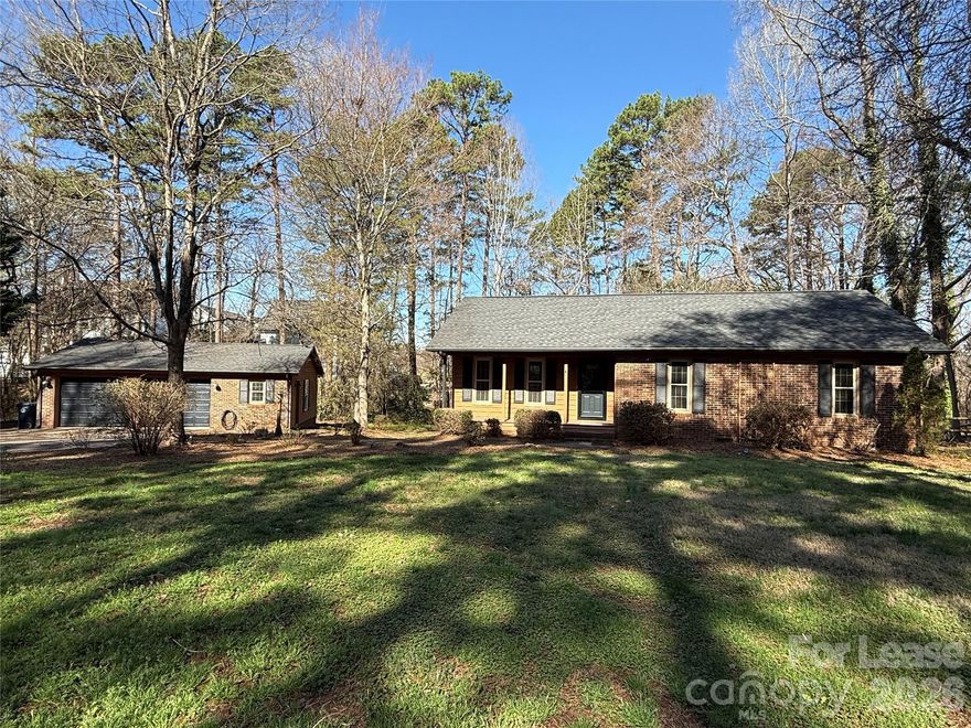 RANCH home near Downtown Cornelius shopping, restaurants and schools with no HOA! Freshly painted interior with many updates! The floor plan has entry that takes you into the open Living Room, Dining area and Kitchen with newer stainless appliances. and tile floor. Down the hall you'll find the Laundry Closet with Washer/Dryer, 2 Bedrooms that share a Full Bathroom, and the Primary Bedroom with Ensuite Full Bathroom. Enjoy the outdoor amenities that include a .66 of an acre lot with mature trees and landscaping, a Front Covered Porch, large Covered Deck and a spacious Fenced Backyard! The Detached 2-Car Garage has automatic openers and an office/workshop room with AC window-unit. Tenant is responsible for all utilities and LAWN MAINTENANCE IS INCLUDED! The Washer/Dryer and garage AC window unit will be as-is. No Smoking and 2 Pets are conditional with a $350.00 non-refundable pet fee. AVAILABLE NOW!