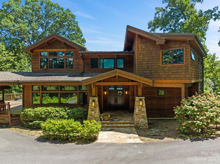 Nestled at 3,800' elevation in the esteemed Avalon community, this luxurious residence is a masterpiece of design & craftsmanship. Its commanding 22-foot wall of windows offers breathtaking panoramas of Mt. Pisgah, Cold Mountain, & Lake Junaluska. Upon approach, you're greeted by a private 450' driveway, flanked by lighted stone pillars, heralding an atmosphere of elegance. The interiors boast high-end custom finishes, a thoughtfully curated art collection, western red cedar throughout, & designer lighting. This fully furnished post-&-beam home is a marvel of engineering & comfort with 5-zone radiant floor heating, a whole-house generator, & 1000 lb capacity 3-floor elevator. A fully equipped bar makes the lower level the perfect spot for social gatherings. Every inch of this home has been crafted with meticulous attention to detail, catering to every whim. A chance to own a slice of Avalon's legacy is rare, making 2128 Sleepy Hollow not just a home, but a treasure to be cherished.