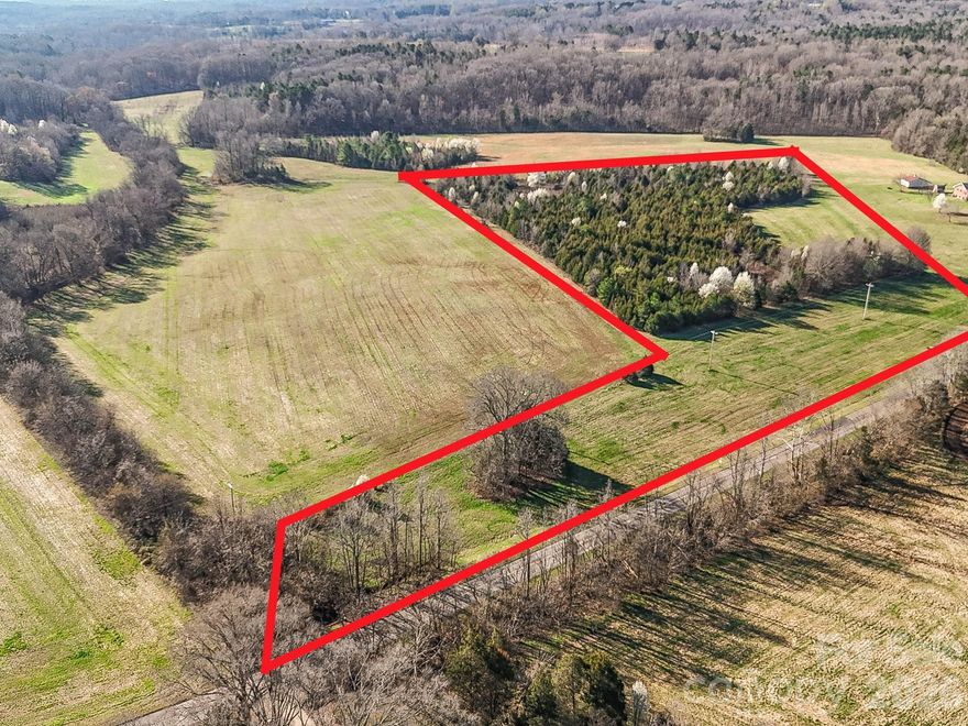 Tucked away in a desirable rural pocket of Mooresville along Patterson Farm Road, this beautiful 13.32 tract offers the perfect opportunity to create something truly special. Whether you envision building a private estate, establishing a school or church, or dividing the property to accommodate up to three homes, the possibilities here are wide open. The land is a blend of open and wooded areas, providing a scenic natural setting with privacy and flexibility for future development. With generous road frontage along Patterson Farm Road, access and visibility make it even more appealing. The property offers a peaceful countryside lifestyle while remaining conveniently located near everything the Lake Norman area has to offer. The new owner has the opportunity to explore and shape the property to fit their vision. If you’ve been searching for land that offers space, privacy, and potential in the growing Mooresville area, this property is a rare gem!