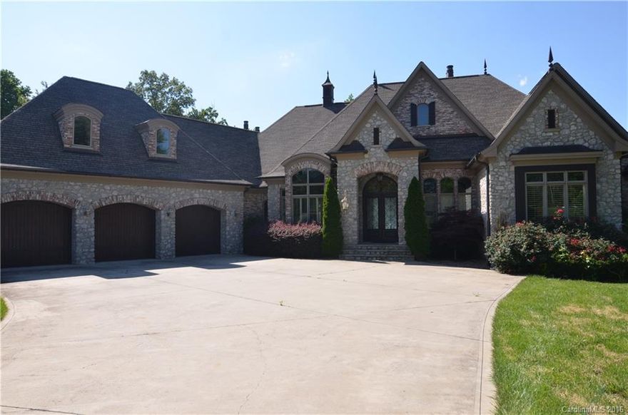 Unbelievable French Country Estate Home on Lake Norman!! Home sits on 1.4 acre lot with wide main channel views, floating dock, in-ground pool with hot tub. Interior is beautifully finished with no expense spared when built. Coffered and barrel vaulted ceilings, office with built-ins, multiple fireplaces, chef's kitchen, Exquisite master suite with elegant tile work in master bath, screened patio with spectacular views of the lake, Gated Community.