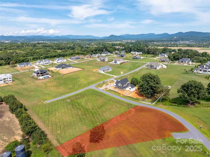Amazing and easy build lot located in Mills River's premier new home community. The Farm at Mills River offers a truly convenient location near highly desirable amenities, easy access, gently topography with city water, city sewer, natural gas, and high-speed fiber-optic internet service. Community amenities include a community gathering space with a fishing and floating pond, small beach, picnic area, and wide gentle roads that are perfect for riding your bicycles. Reasonable HOA fees. Quietly nestled just minutes from both Asheville and Hendersonville and super convenient to Asheville Regional Airport. Everything you ever wanted in a mountain community. Call and schedule a
tour today.