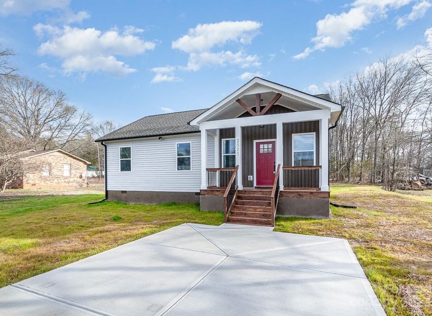 NEW PRICE FOR QUICK SALE! Picture perfect new construction home on a .46 acre lot w/ No HOA featuring TONS of modern finishes & upgrades! The vaulted front porch welcomes you into this ranch home with OPEN floorplan, large living rm w/ cathedral ceiling, oversized ceiling fan, LVP flooring & lots of windows. The kitchen features soft close white cabinets, granite counters, large breakfast bar, stainless appls, beautiful tile backsplash, farmhouse sink, hood & breakfast area w/ sliding doors to the deck overlooking the spacious bkyard. Make your way to the amazing primary suite w/ 2 closets (1 walk-in), LVP flrs & unbelievable bath showcasing oversized tile surround shower w/ rainfall fixture, glass door, tile floors, double vanity w/ granite ctrs & farm house lighting. There are 2 add'l bedrooms plus hall bath w/ tile surround shower, granite ctr & tile flrs. Home has no carpet - all tile & LVP. Pay only COUNTY taxes! Rare find at this price with so many upgrades!