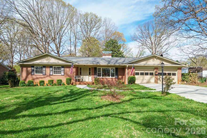 Step into comfort, space, and thoughtful upgrades in this sprawling ranch designed for both everyday living and all your hobbies. From the moment you arrive, the concrete driveway and inviting setting set the tone for what’s inside. The great room welcomes you with a beautiful granite fireplace, built-ins, and an open flow into the dining area—perfect for gathering. The updated kitchen is truly the heart of the home, featuring granite countertops, a center island with seating, gas cooktop, GE Profile oven, deep sink, new tile flooring, and abundant cabinetry with convenient pull-outs. Open to the kitchen is the cozy den with a second fireplace. An exterior door to a screened porch and covered outdoor space—ideal for relaxing evenings or entertaining. A working hot tub remains, along with access to a walk-in cellar with a new vapor barrier. All bedrooms showcase original hardwood floors and natural light. The primary suite offers a walk-in closet, an additional closet, and a private bath. For those needing extra space, this property delivers: attached 2-car garage, fenced yard, tall RV/boat carport, workshop shed, and a detached single garage—room for vehicles, hobbies, and more. With major updates already completed—including roof, windows, gutters, plumbing, and HEAT PUMP—this home offers peace of mind along with exceptional functionality.