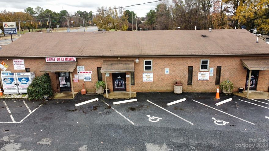 Nestled in the heart of Northwest Charlotte's burgeoning landscape, this single-story multi-use gem commands attention on a  0.708-acre canvas, positioned perfectly at the crossroads of opportunity. From its strategic corner vantage point, this property offers an enviable immediacy to major highways, ensuring a steady flow of traffic and accessibility as well as a picturesque view of the Uptown Charlotte skyline.  Here, the possibilities are as boundless as the Carolina sky; a dream for any start-up or well established business.  this is where community and commerce intersect to create an urban tapestry woven with promise and prosperity.  Showings on Sundays only with a 24 hour notice, and all showings must be confirmed and approved by the listing agent...Please do not disturb sellers or current tenants!!! Hardware inventory, business name and salon furnishings are not included in the sale.