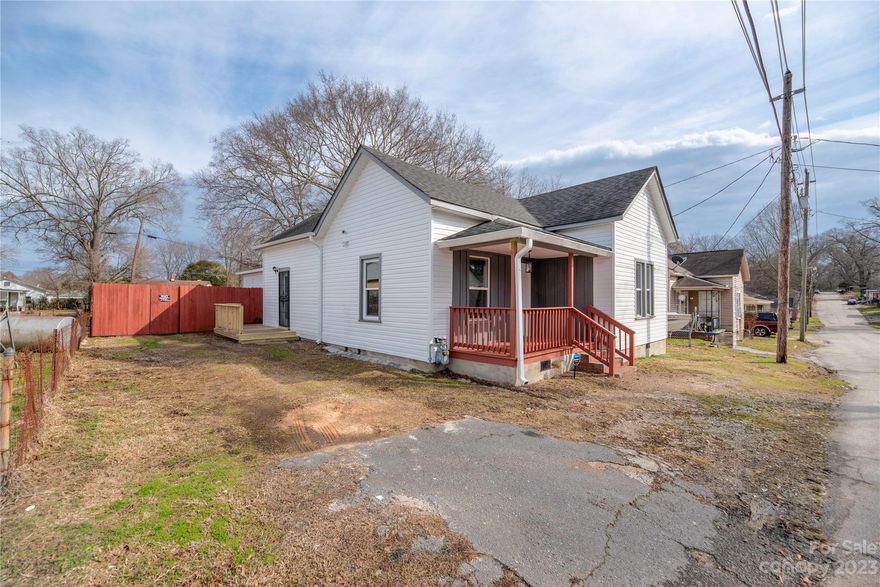 This move-in-ready home is a must-see!! One of the most spacious homes in Eureka Mill featuring 1400+ square feet. This home has been completely renovated from the foundation up. It prioritizes safety with a built-in security system, security doors, and security lighting. Everything is new in this home. Plumbing, electrical, HVAC, siding, and more!! As you enter the great room from your covered front porch, you'll see an open floor plan that connects the large eat-in kitchen featuring abundant cabinet and counter space, a huge pantry, and two large bedrooms in the front of the home. As you walk through the hallway, you'll pass a large bathroom with a separate laundry room with built-in storage. Continuing, you'll enter the owner's suite. A retreat complete with double walk-in closets, a large attached private bath with a tiled shower, and a separate built-in lighted dressing vanity with a mirror. Add a full privacy fenced backyard with a shed and this home truly has it all!
