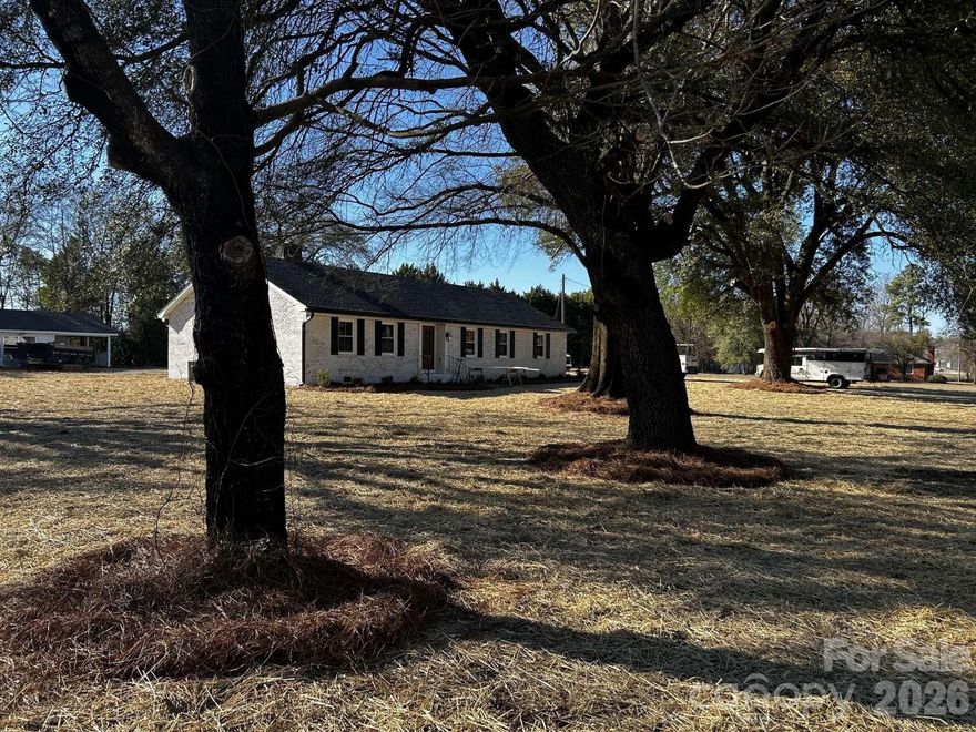 4 Bedroom home on 1 acre with 1000 sq ft workshop (utilities available). Price Improvement! Seller offering up to $10,000.00 toward closing costs. Drive up to this beautifully remodeled home with lovely mature trees that scream southern charm and hospitality! Welcome to 1108 Evans Mill Rd! This completely transformed, from top to bottom home, boasts over 2500 square feet of space with an improved layout for functionality and openness. The hard work has been done for you! Once you enter the foyer through your new double wooden front doors, your spacious den is to your left, and the dining room is to your right. Beyond the dining room is the well appointed kitchen, with a cozy sitting room included. Let’s talk about the upgrades: all new duct-work, insulation, fully gutted baths, upgraded electrical, new double paned windows, a brand new kitchen with stainless appliances, new LVP flooring, new gutters, sleek granite countertops in all 3 baths and kitchen, and all new lighting throughout. The floorplan is split with 2 spacious bedrooms on one side sharing a hall bath and two masters on the other side each with their own bath and walk in closets. You could easily use one as a roomy guest space, home office or MIL suite. The brick has had a face-lift with a German smear technique that doesn’t require routine maintenance and new shutters were added as well. And outside?? Well, there’s a detached two car garage, concrete circular drive, grand oak trees, completely refreshed landscape and an extra 1000 sq ft building waiting for your personal touches! Think man-cave, hobby-house, MIL space, Workshop; whatever you want to use it for. The possibilities are many! Bring your ideas and make it yours. All this is on 1 full acre. Enjoy this “better than new” home with so much character and too many upgrades to mention. Come see it for yourself! You'll be glad you did.