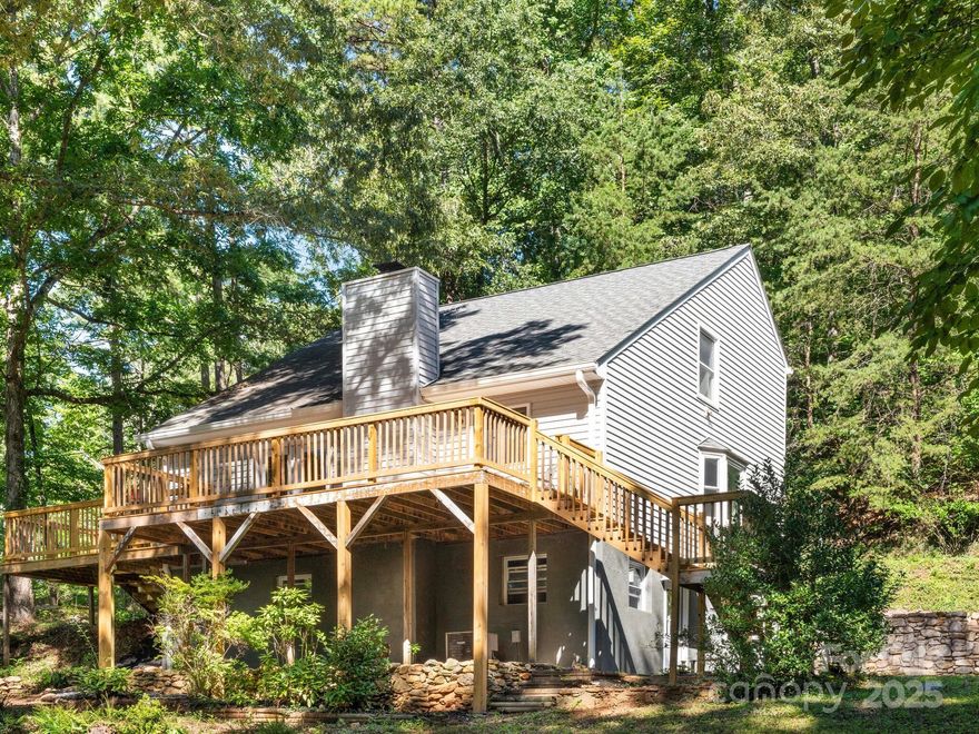 PRICED BELOW APPRAISAL! Welcome home to this beautifully updated 3BR/2BA home on 1.75 acres in the desirable Candler community.  Recent upgrades include new windows, luxury vinyl plank flooring, fresh paint, kitchen cabinets, granite countertops, stainless appliances, updated baths, and a new large rear deck, making this home truly move-in ready.  The spacious living room features a wood-burning fireplace with insert, perfect for cozy evenings.  Mechanical updates include a new electric water heater and a new 200-amp electrical panel.  Plus, the heating system has an electric air cleaner installed, providing comfort and peace of mind.  Enjoy easy living with a one-car garage (with room for two cars, or your colf cart/fourwheeler), and could have a circular drive with a little work to the road that's already installed, just wasn't used much by the previous owner.  Also, there's a detached shed for your lawnmower and other tools!  The 1.75-acre lot offers both privacy and flexibility to garden and entertain.  All this and just minutes to Asheville, yet tucked away in a quiet setting, this home offers the best of both worlds.