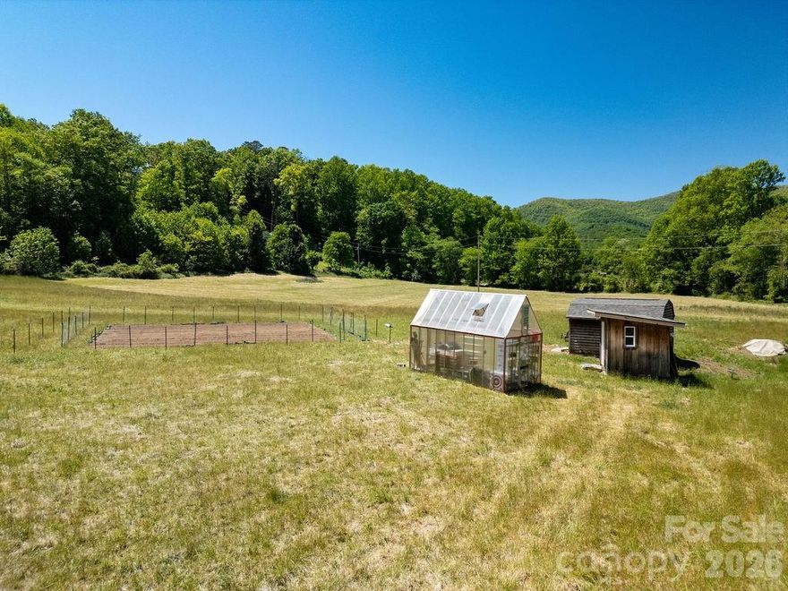Discover the freedom and beauty of mountain living with this exceptional +/-3.75-acre unrestricted property which includes an approx. 1 acre section of private wooded acreage and exceptional pasture land in the Balsam Grove, North Carolina area. Surrounded by the natural beauty of WNC, this versatile tract features a serene creek, natural spring, open pastureland, and an ideal build site perfectly positioned to take in the tranquil setting. Whether you envision a private mountain retreat, mini-farm, custom home, tiny home getaway, or RV retreat, this property offers endless potential with no restrictions limiting your vision. The property includes access to a shared well per deed and also has an active septic permit on file providing a valuable head start for future development. A variety of land/home packages and custom build opportunities could make this the perfect investment, primary residence, or vacation property. Ideally located near the Blue Ridge Parkway and Pisgah National Forest, outdoor enthusiasts will appreciate the close proximity to some of the region’s best hiking trails, mountain biking, fly fishing, waterfalls, and year-round recreational adventures. Rare unrestricted acreage in such a sought-after mountain location is becoming increasingly difficult to find, but here it is!