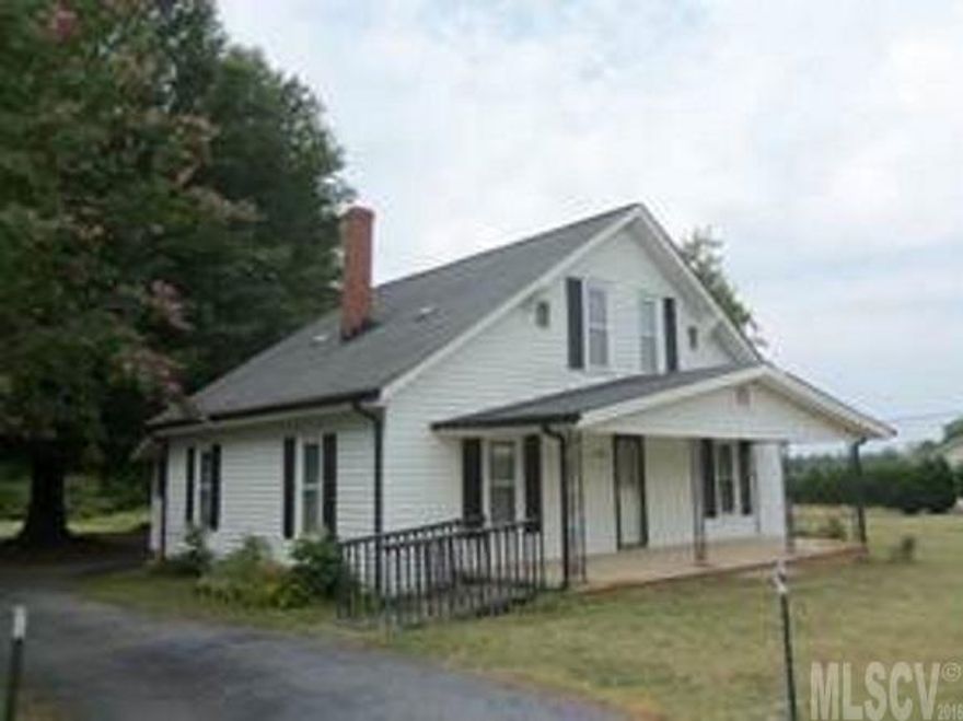 Yesterday's charm!  8.5 Acres, 2BR/1BA bungalow, barn, and carport/shed in a great location off Springs Road.  Partially cleared with great area for garden, etc. Rear of property is wooded-creek meanders along back of property line. Per owners-Windows replaced 15-20 years ago, Heat approx. 2 years old, AC approx. 10 years old, Roof replaced around 2001. One room used as bedroom does not have closet. Woodstove stays. 2nd level does not have heat source and is not included in heated square footage. Per owners, some remodeling in early 50's included addition of bath.  Laundry located on enclosed back porch.  City water.  Old hand dug well-not in use.  Great project for the handyman!   Being sold in "as is" condition.