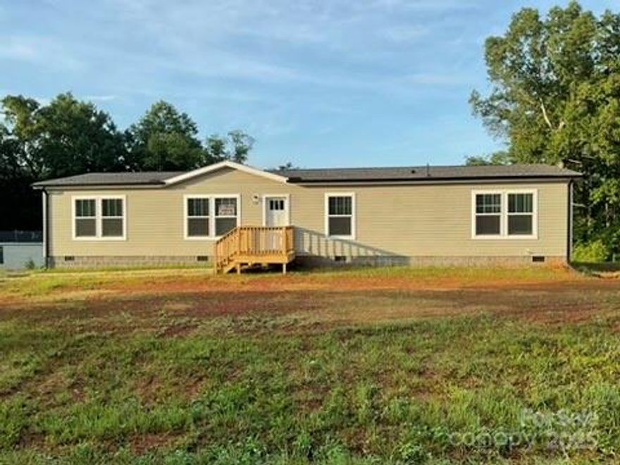 Welcome to this beautifully designed 3-bedroom, 2-bath home in a peaceful neighborhood with no HOA—giving you the freedom to truly make it your own. Inside, the open floor plan and durable Vinyl flooring create a clean, modern vibe. The kitchen stands out with a large center island, stainless steel appliances, and an oversized breakfast bar—perfect for quick meals, coffee, or hosting.

One of the best features? There’s both a spacious living room and a separate family room—ideal for relaxing, entertaining, or setting up a home office. The primary suite includes a walk-in shower and dual sinks with individual mirrors for extra convenience. The two additional bedrooms are generously sized and versatile.

The laundry/utility room is super functional with a sink, cabinetry, and space for folding or ironing. Outside, enjoy a large backyard perfect for pets, grilling, or future projects. This home is stylish, practical, and move-in ready—come see it in person!