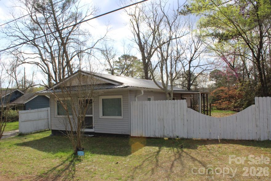 CUTE AND AFFORDABLE!!  1 Bedroom, 1 Bathroom Cottage in Mill Spring - on .41 acre lot!  The home features all new LVP flooring, a fenced yard, a new large storage building, and a detached workshop with power that could be converted into a livable space!  Located on the corner of HWY 108 and Whitetail Lane, just a short drive to Pea Ridge Rd & the Equestrian Center.  Great Place to crash during the show season or buy for an investment purpose.   The only thing is.... The house does not have water - and it needs a well.  Owner has a well permit in hand.  Contact an Agent with questions!