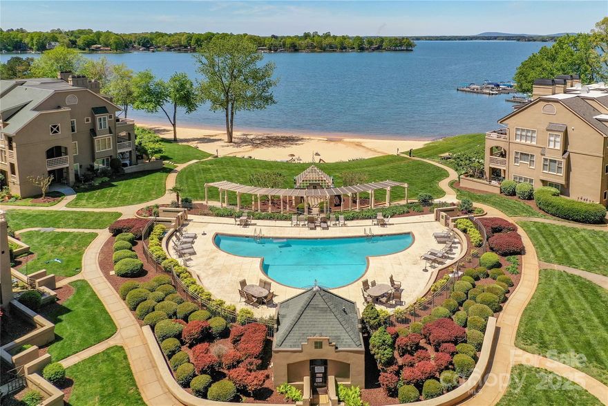 Completely renovated 3-bedroom 2-bath condo in the Portside complex of Davidson Landing. 3rdfloor location has an amazing sunset view of the Lake. New premium Mirage wood floors throughout condo. All new crown moldings, door trim, & baseboards. All doors have been replaced with 2-panel SOLID wood doors & new hardware. All new windows. The patio doors were replaced with an Anderson Premium four-panel center-parting full view door, so the lake view is even better. A load-bearing custom-built header was installed for this new door. All new lighting with over 24 recessed LED lights and new bathroom vanities. Kitchen has new semi-custom cabinets, under cabinet lighting, quartz countertops, new fixtures, new hardware, & stainless-steel appliances. Custom shiplap wall & tile fireplace surround with custom wood beam mantle. Primary bathroom has an extended shower with custom tiling & a full-width glass door. The 2nd bathroom has a new Kohler tub & custom tile surround. New HVAC & water heater.