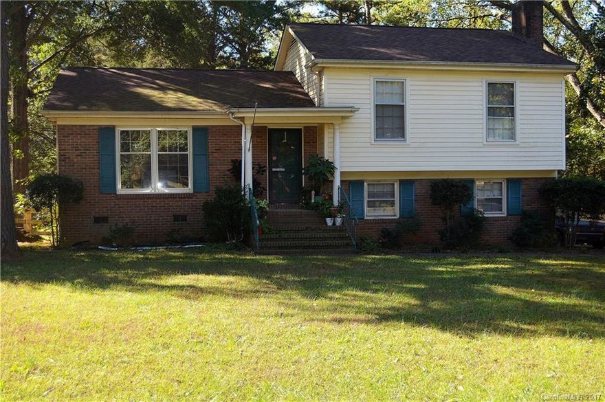 Location! Close to UNCC; split level on large lot, with fenced yard.