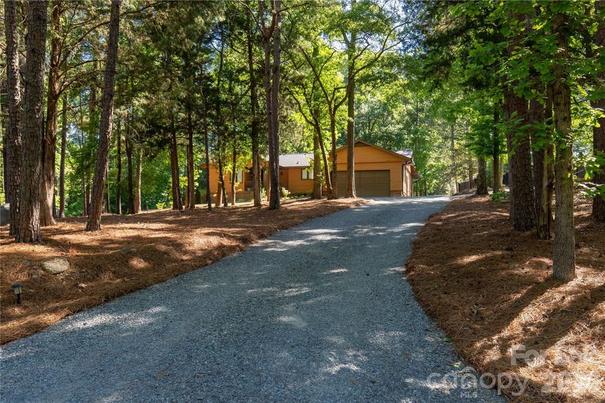 Welcome to 328 Dana Drive. This home features a natural setting with thoughtful landscaping, space for extra vehicles, and an attached garage. Inside, enjoy a wood-burning fireplace in the great room with easy access to the updated kitchen. The primary bedroom is oversized, so there is room for a sitting area, office space, or exercise. Enjoy summer evenings on the oversized porch overlooking a lush green yard. Roof replaced in 2024.