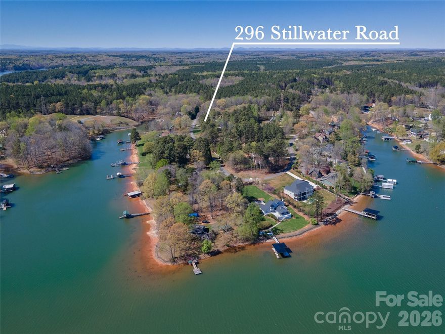 Lovely ranch home located in the desirable waterfront Community of Stillwater Estates, set on approximately 1.76 acres with gorgeous year-round views of Lake Norman.  This home features a 3-bedroom split floor plan with an open layout perfect for both everyday living and entertaining.  The kitchen offers abundant counter space along with functional island, making it the ideal space for cooking and gathering.  The primary suite includes jetted garden tub, and a tiled shower for a relaxing retreat.  Enjoy peaceful evenings on the screened-in back porch, or take in the beautiful lake views from the front of the home.  Conveniently located approximately 2.5 miles from Lake Norman State Park, offering swimming hiking, picnic areas, wildlife viewing, fishing , and a public boat launch-perfect for enjoying everything lake life has to offer! All of this with NO HOA.