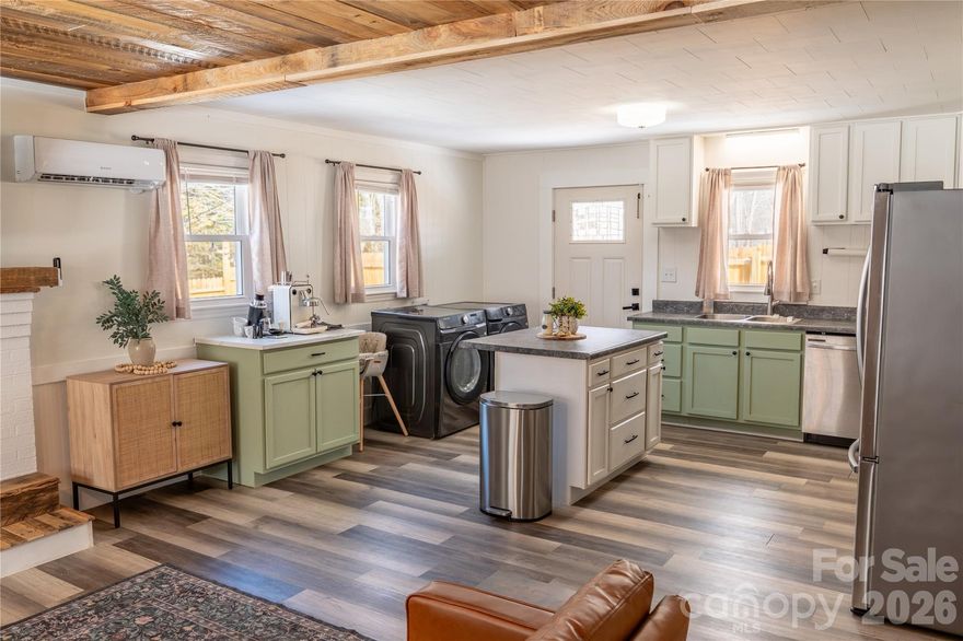 Move-In Ready! This recently updated sweet brick ranch is in the Cruso area of Canton, just across the road from the beautiful Pigeon River.  Swimming holes abound and hiking is close by!  10 minutes to downtown Canton.  35 minutes to Asheville.  Blue Ridge Parkway is just 20 minutes.  Fully fenced-in yard allows for pets and play.  Recently-installed 2024 mini splits provide heating and cooling, with an additional wood pellet stove for energy-efficient heat.  Barn-doors, wood trim, and ship lap create a cozy, rustic feel.  New fixtures, a welcoming fireplace, newly painted kitchen cabinets, and newer appliances offer a warm entertaining space.  One level living and a quaint low maintenance yard make this home perfect for any stage of life.  Recent survey.  New water heater December 2025.