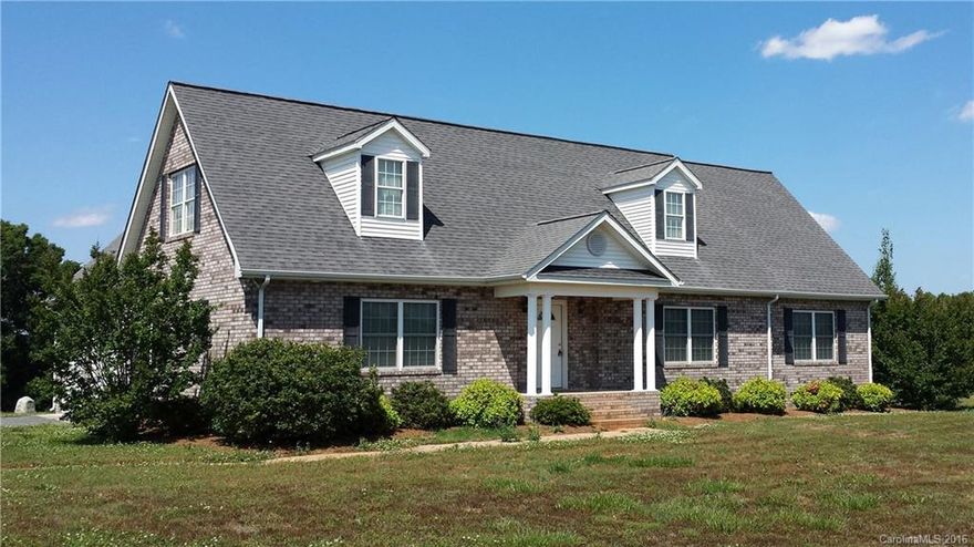 Looking for wide open spaces and a large home with four bedrooms.  Master bedroom on main with new carpet.  Additional private suite with bedroom and living area that has a sink, a place for a fridge and walk in shower with bench seats on main floor.  Nine foot ceilings on main.  Upstairs area has big rec room and two large bedrooms!  24x40 separate shop and an attached garage!  Fresh paint on main and hardwood floors in living areas.   MOVE IN READY