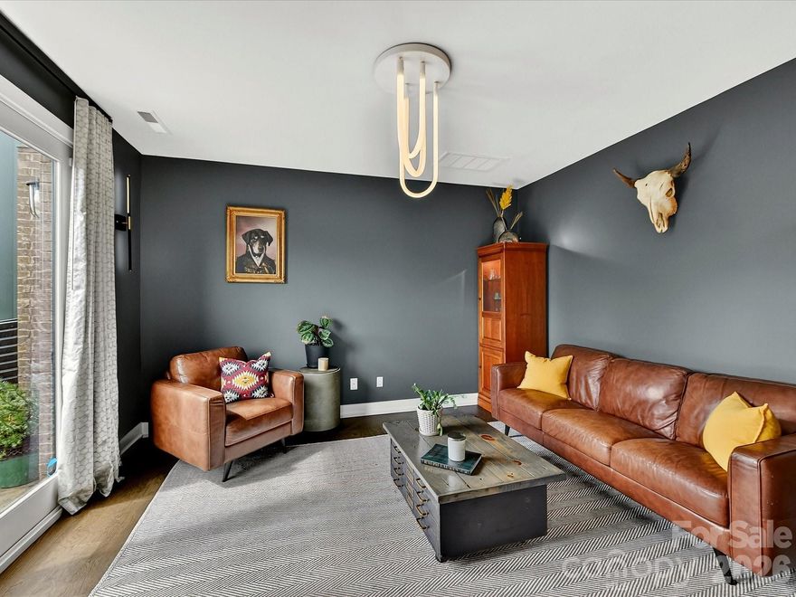 With 2,465 sq ft are you seeking SPACE in a prime location? Look no further — this is the ONE!

Perfectly situated in the heart of Villa Heights in Charlotte’s sought-after Circuit District, this gorgeous end-unit townhome offers the ultimate location.  Enjoy close proximity to some of the hottest restaurants, shopping and nightlife in Plaza Midwood, NoDa, Belmont, Optimist Hall, and Uptown.  Just minutes from the light rail, trolley, and the greenway—what more could you ask for.....wait, also, just steps away from one of Charlotte’s newest hotspots, Mezzo Market.  Yes, Please! Live your best car-free lifestyle right here.  

Inside, you’ll find a light-filled, beautifully appointed home with soaring ceilings throughout and noise-reducing windows, offering peace and quiet while being in the center of it all. The spacious kitchen boasts an oversized island and abundant cabinetry, flowing seamlessly into the open floorplan — ideal for both everyday living and entertaining.

Thoughtful updates include fresh paint throughout, a stunning, updated half bath featuring custom board and batten and wallpaper, updated high end designer lighting, and stylish mirrors throughout much of the home. Step outside to your fully fenced outdoor retreat complete with a custom hardscaped patio and side yard — perfect for gardening, relaxing, or your four-legged friends.

Additional highlights include: 3 bedrooms plus a dedicated office, side-by-side 2-car garage, custom up/down window treatments throughout much of the home, water included in the HOA fee, and an abundance of natural light from end-unit positioning

Don’t miss this Villa Heights dream — where location, lifestyle, and comfort come together seamlessly.
Showings begin on Friday, March 13th.  Parking available on Barry St. and Lola Ave.

Assumable loan $450K at 4%