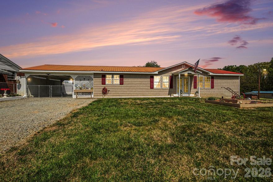 Looking for a place to live and enjoy your hobbies at home? This versatile property offers a 2-bedroom, 2 bath home with an open-concept kitchen, living, and dining area—perfect for everyday living. The nicely updated kitchen flows seamlessly into the main living spaces, and a spacious laundry room adds extra convenience. The home also features a comfortable primary bedroom with updated ensuite bath, a fenced yard, and a carport for additional covered parking. Ideal for hobbyists, the property includes a dedicated workshop building previously used for autobody work, complete with an exhaust fan and recently added attic insulation. A standout feature is the impressive 40 x 40 three-bay garage/building built in 2017, equipped with 220 electric service and a floor drain. The middle bay features an extra-tall garage door, making it perfect for RV storage. Whether you're into cars, or need extra space, this property combines comfortable living with exceptional functionality.