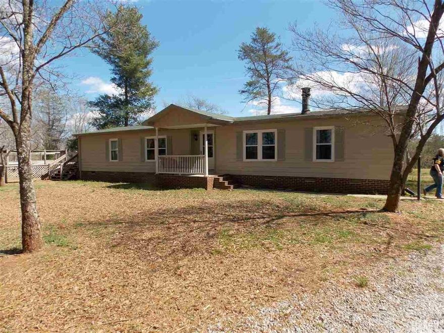 Nice home w/ 2 acres and many updates, 3 bedroom 2 bath home, den and dining room, new laminate floors, new cabinets, 2014 roof, fresh paint throughout the home, Looks like a new home, walk in closets, lots of storage, large deck, fireplace, detached 3 bay garage for the handy man, also has a storage building, great area, no city taxes!