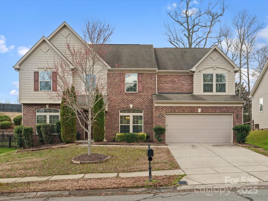 Seller will pay up to $10,000 toward buyers closing costs with acceptable offer! Step into this stunning, spacious 4-bedroom home in Cannon Crossing! Perfectly located within walking distance to shops and dining at Cannon Crossroads, this home offers both convenience and comfort. Inside, you'll find a beautiful formal living and dining room—ideal for entertaining—plus a versatile office or playroom on the main level. The great room boasts a gorgeous stone fireplace create a cozy atmosphere. Spacious kitchen perfect for entertaining or everyday-features an oversized island, gas range, stainless steel appliances, and plenty of cabinetry and counter space. A bright, vaulted-ceiling breakfast area. Upstairs, retreat to the huge primary suite and spacious bonus room, along with three additional bedrooms and a convenient laundry room. Enjoy outdoor living with a large yard and patio!  Fresh neutral paint & new carpet! Walk to shops & restraunts. Community pool, playground, & club house.