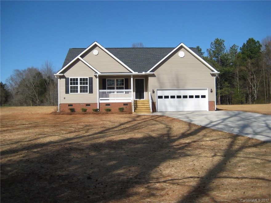 Stunning new construction w/split bedroom plan, kitchen w/granite, black appliances, laminate flooring in kitchen, breakfast area, family room (vaulted ceilings), hallways and entry way, covered back porch, gravel driveway leads to concrete entrance to double concrete pad entering garage, 1 Acre lot.