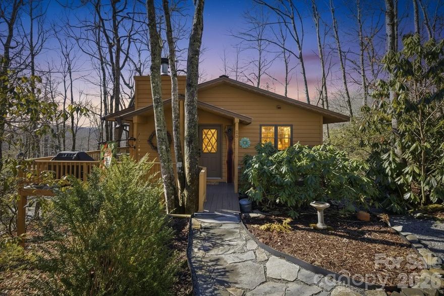 Escape to your own Blue Ridge retreat in the highly sought-after Linville Land Harbor community, where mountain charm meets resort-style amenities. This 2 bedroom, 3 bath cottage offers 1,226 square feet of warm, inviting living space and is perfectly suited for those seeking a low-maintenance second home in the High Country. Tucked away on a private, wooded quarter-acre lot, the setting feels peaceful and secluded while still benefiting from 24-hour security and the ease of an established POA community designed for effortless mountain living. Inside, the home is full of character and cozy appeal, featuring a beautiful wood-burning stone fireplace that creates the perfect atmosphere for crisp mountain evenings after a day of enjoying the mountains. The functional kitchen offers ample storage and a comfortable layout ideal for weekend getaways or extended seasonal stays, and generous closet space throughout makes it easy to settle in without feeling cramped. A spacious, partially covered deck runs along the side of the home, creating a serene outdoor retreat for morning coffee, evening wine, or entertaining guests surrounded by nature. The partially finished lower level adds valuable flexibility with a family room, additional bedroom, bath with laundry, and a one-car garage with extra space for a golf cart or outdoor gear, making it easy to enjoy everything the community has to offer. Linville Land Harbor amenities include 24-hour security, a clubhouse, country club, golf course, lake access, river access, pickleball, tennis, and a pool, offering endless opportunities for recreation, relaxation, and social connection just moments from your door. Whether you are searching for a seasonal mountain escape, a lock-and-leave secondary residence, or a potential short-term or long-term rental opportunity in a highly desirable High Country community, this charming cottage delivers comfort, privacy, lifestyle, and investment appeal all in one.