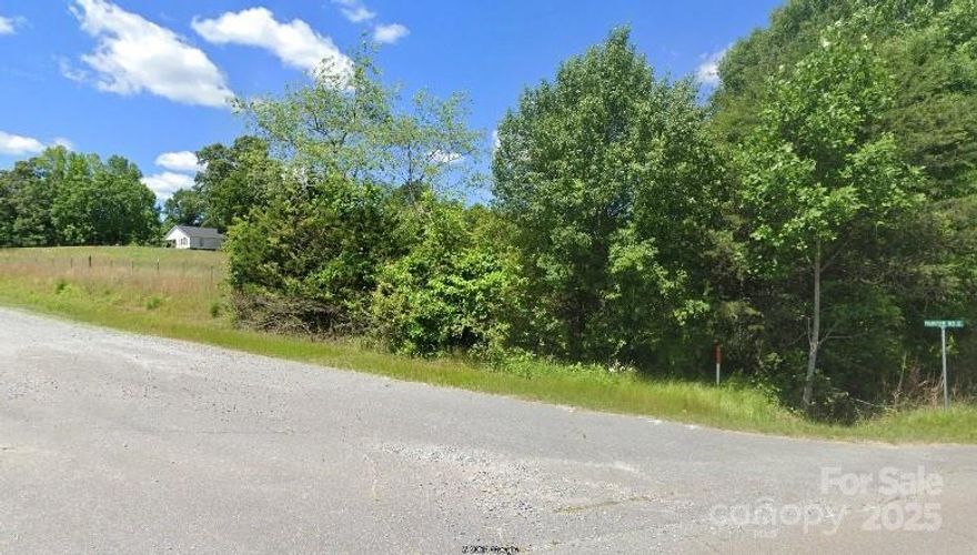 This beautiful corner lot has trees on State Line Rd for privacy, but great open space for country living or animals.  It is partially fenced, too.  About 500 feet on State Line Rd and 160 feet on Painter Rd.  Lot is about a mile to US Hwy 221, and conveniently located just north of Chesnee SC.  About 20 min south of Rutherfordton NC and the Tryon Equestrian Center.
