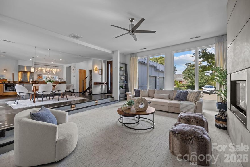 A rare opportunity to own a modern home in one of Charlotte’s most dynamic communities.
Step inside to an open and light-filled main living space where contemporary architecture meets effortless entertaining. The sleek kitchen and sunken living room create a welcoming hub for gatherings while maintaining the clean lines and modern aesthetic that define the home. 

The primary suite offers a true retreat with a walk-in closet, spa-inspired bath, and a private attached flex space ideal for a home gym, executive office, lounge, or nursery. Additional bedrooms upstairs provide versatile spaces perfect for guests, remote work, or creative studios.

The true showstopper is the rooftop terrace — an incredible space to entertain, unwind, and enjoy sunset views above one of Charlotte’s most vibrant neighborhoods. Just moments from restaurants, coffee shops, breweries, galleries, and convenient access to the LYNX Blue Line, this home offers the ultimate NoDa lifestyle where everything you love is within reach.

Custom shades and curtains to convey. Home was designed by Charlotte Architect Curtis Sloop. Fireplace is sold as-is, no known issues. The recent addition is 545.5 sq ft, the projector, projection screen and turf to convey, the Trackman Golf Simulator attachment will not convey (can share information of how/where to purchase as there are many options available) or can discuss as an additional item to purchase from seller. Fresh paint, upstairs HVAC, refrigerator & dishwasher replaced 2024 and tankless water heater 2025. Floors and kitchen countertops just refinished.