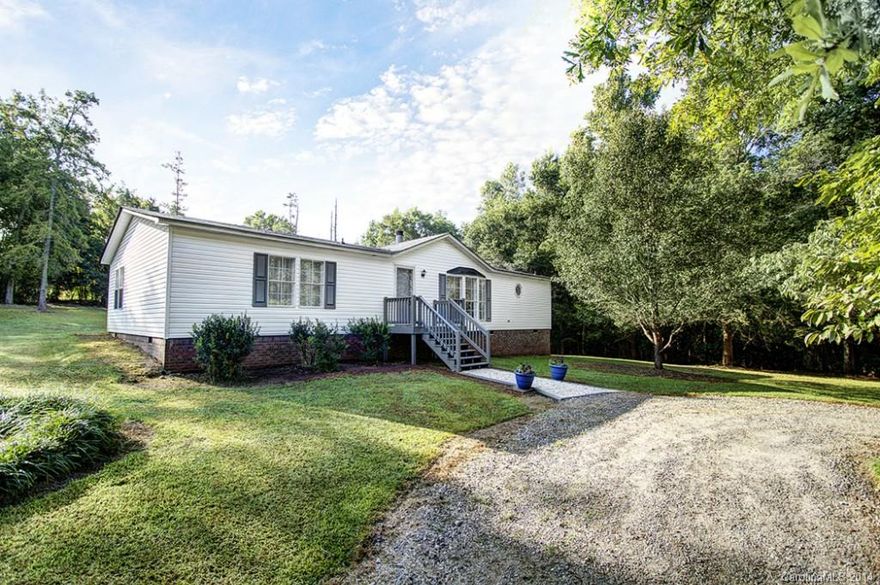 Lovely on-frame modular ranch home w/3BR & 2Ba.  Well-kept and neat as a pin on more than 2 acres.  Well laid out floorplan with spacious bedrooms.  Private setting includes long gravel driveway, deck overlooking quiet backyard and detached 2 car garage/workshop.  Conveniently located near NC/SC border of Indian Land and Pineville.  USDA eligible. Buyer/Agent to verify all pertinent info necessary in the decision making process; i.e., SqFt, zoning, schools, age, lot size, etc.