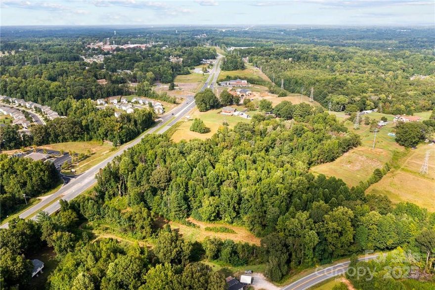 28 acres - Potential Commercial development. OPPORTUNITY ZONE. Within 2 miles of Interstate 85 via new Beatty Ford Rd. interchange. Property extends on both sides of Bostian Rd. and can be sold separately. The portion on the west side of Bostian Rd has Hwy 29 access and is offered at $2,000,000. The portion on the east side of Bostian Rd is being offered at $1,500,000. The entire property is being offered for a total of $3,000,000. Buildings on the property are conveyed at no value. Natural gas accessible.  This can also be combined with parcels 129145 & 129024 - see MLS 3783225. There are many options. Please do not enter the property without an appointment.